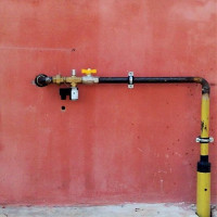 Laying a gas pipeline in a case through a wall: the specifics of a device for introducing a pipe for gas into a house