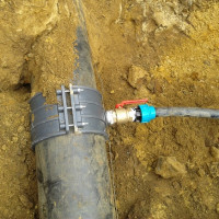 How to insert into an existing water supply system under pressure