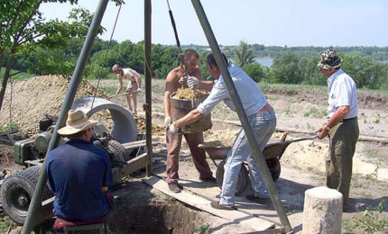Using a tripod to lower rings into a well