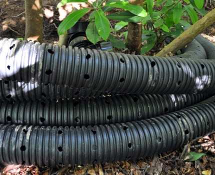 Perforated polymer pipes for drainage