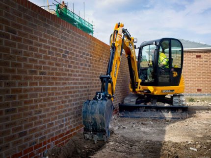 Mini excavator for digging trenches