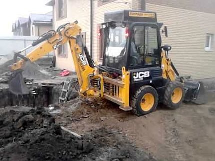 Digging a hole by an excavator