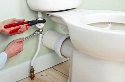 Attaching the toilet to the pipe