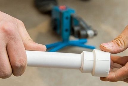 Soldered plastic pipe with fitting