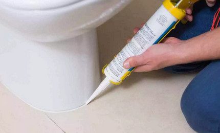 Installing the toilet on the sealant