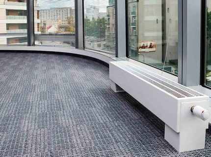 Convector in a room with a large area of ​​glazing