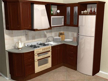 A refrigerator is integrated in the kitchen design