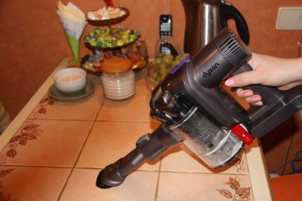 Cleaning the table with a vacuum cleaner
