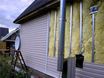 A layer of vapor barrier on the outside of the house
