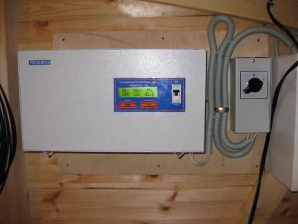 Voltage stabilizer on a wooden wall