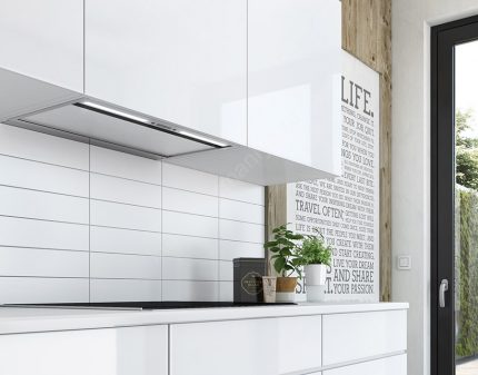 Cooker hood integrated in the kitchen