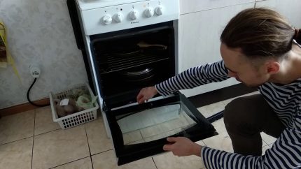 The process of removing the oven door