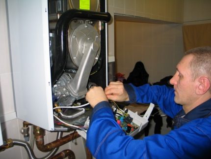 Gasman works with a boiler