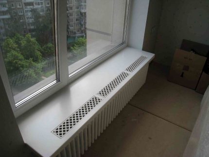 Recessed ventilation grill in the windowsill