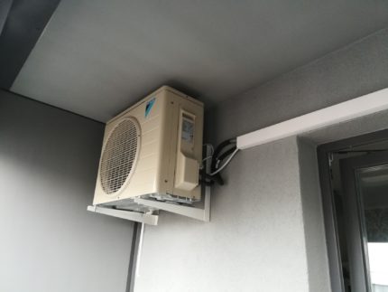 Outdoor unit on an open balcony