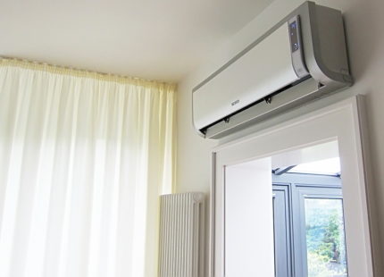 Rectangular air conditioner above the doorway